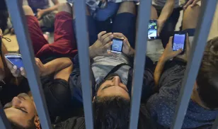 Refugees on mobile phone cell phone