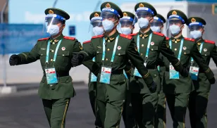 Members of the Chinese Military march through the Paralympic Village at the 2022 Paralympic Winter Games in Beijing, China.