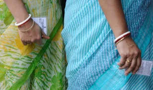 Women stand in line to cast their ballots for the Indian general election.