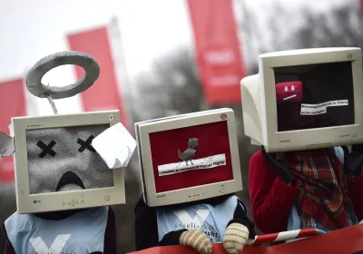 Protesters gather to demonstrate against internet censorship in China, one of the partner countries of the CeBit computer trade fair held in Hanover, Germany (March 2015). Cover image by Alexander Koerner/Getty Images