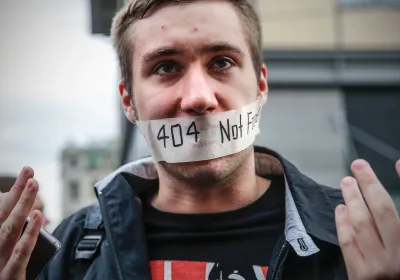 A man gestures during a protest in Moscow on August 26, 2017. Nearly 1,000 Russians protested during a demonstration against the intensification of surveillance and restrictions on the Internet, marked by at least eight arrests.