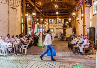 People in Kuwait City, Kuwait. Editorial credit: Matyas Rehak / Shutterstock.com