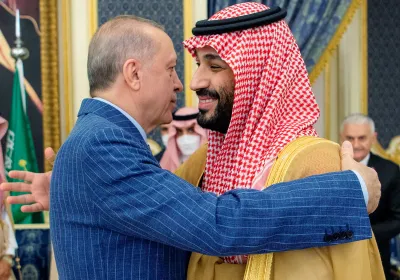 Turkish president Recep Tayyip Erdoğan embraces Saudi crown prince Mohammed bin Salman Al Saud.