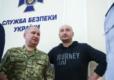 Two Ukrainian Men Standing At A Government Building