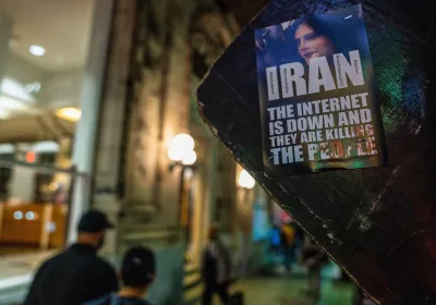 A sticker saying ''Iran: The internet is down and they are killing the people'' seen on the back of a road sign