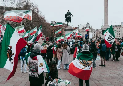 People gather in Trafalgar Square. London for a protest in support of human rights defenders and protesters in Iran.