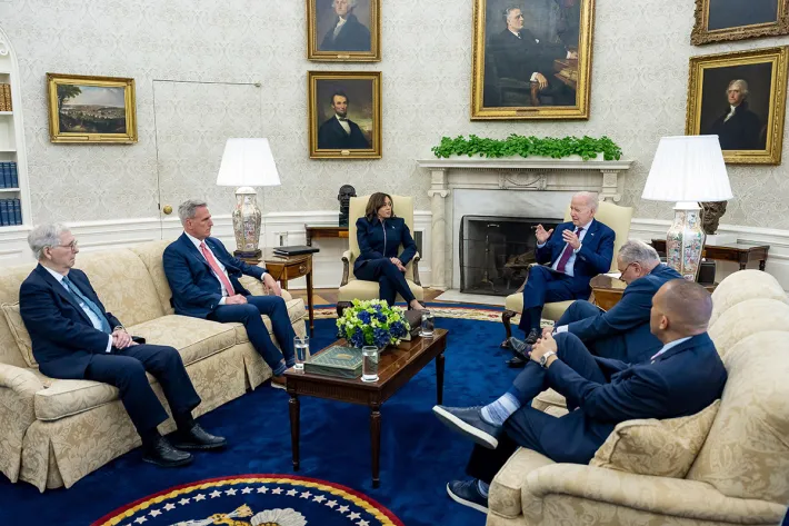 US President Joseph Biden speaks during a meeting with congressional leadership to discuss the debt ceiling at the White House in Washington, DC on May 16, 2023. Sitting from left to right are: Senate Minority Leader Mitch McConnell, House Speaker Kevin McCarthy, Vice President Kamala Harris, President Biden, Senate Majority Leader Chuck Schumer, and House Minority Leader Hakeem Jeffries. (Photo: Adam Schultz/White House Photo/Alamy Live News)